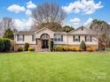 Charming home with manicured lawn, stone accents and inviting front entrance at 2200 Peninsula Ave, Shelby, NC 28150