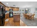 Traditional kitchen with granite countertops, an island, and wood cabinets at 2200 Peninsula Ave, Shelby, NC 28150