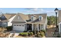 Aerial view of home with a manicured lawn, mature trees, and a well-maintained yard at 305 Kentmere Ln, Clover, SC 29710