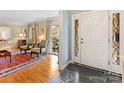 Elegant entryway featuring slate floors, a decorative front door, and a view into the living room at 3625 Mill Pond Rd, Charlotte, NC 28226