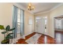 Inviting foyer with hardwood floors, elegant lighting, and a view of the front door at 418 Garnet Ct, Fort Mill, SC 29708