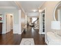 Elegant foyer with hardwood floors, detailed trim, and a view of the living space at 875 Stratford Run Dr, Fort Mill, SC 29708