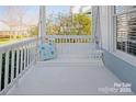 Inviting front porch with a swing and a decorative pillow, perfect for relaxing outdoors at 875 Stratford Run Dr, Fort Mill, SC 29708