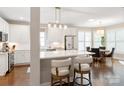 Open-concept kitchen with a breakfast bar, modern appliances, and a light and airy breakfast nook at 875 Stratford Run Dr, Fort Mill, SC 29708