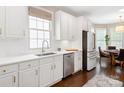 Bright kitchen featuring white cabinets, stainless steel appliances, and a view of the breakfast nook at 875 Stratford Run Dr, Fort Mill, SC 29708