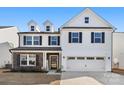 Charming two-story home with black shutters, neutral siding, and a two-car garage at 838 Foxglove Ln, York, SC 29745