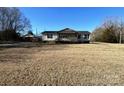 Exterior shot of charming home with large yard and detached carport at 1637 Owens Rd, Chester, SC 29706