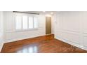 Bright living room with beautiful hardwood floors and decorative wall trim at 1831 Jameston Dr, Charlotte, NC 28209