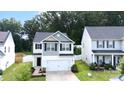 Charming two-story home with a well-manicured lawn, a two-car garage, and beautiful curb appeal at 1953 Boulder Ct, Gastonia, NC 28054