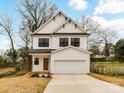 New construction home featuring white siding, a two-car garage, and a well-manicured front lawn at 2615 Brentwood Pl, Charlotte, NC 28208