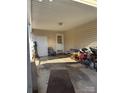 Carport with concrete floor, and access doors leading to interior spaces at 303 Ellenwood Dr, Albemarle, NC 28001