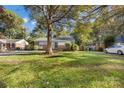 Expansive front yard featuring mature trees and a well-kept lawn at 4635 General Pershing Dr, Charlotte, NC 28209