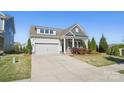 Lovely single-Gathering home with a well-kept lawn and a two car garage, offering suburban living at its finest at 5004 Oakmere Rd, Waxhaw, NC 28173
