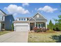 Beautiful single-Gathering home boasting a well-maintained lawn, stone accents and a two car garage in a Gathering-friendly area at 5004 Oakmere Rd, Waxhaw, NC 28173