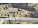 Expansive aerial view of property and land featuring road access and mature trees at 6285 Nc 16 N Hwy, Taylorsville, NC 28681