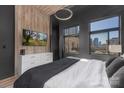 Modern bedroom with a city view, stylish furniture, and a sleek design with hardwood accents at 715 N Church St, Charlotte, NC 28202