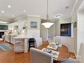 Cozy dining area with a wood table, pendant lighting, and stylish decor, perfect for intimate meals at 9410 Cadman Ct, Cornelius, NC 28031