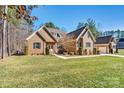 Charming brick home with well-manicured lawn and tasteful landscaping at 106 Wolf Hill Dr, Mooresville, NC 28117