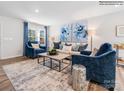 Stylish living room with comfortable seating, blue accents, modern decor, and abundant natural light at 1199 Blackburn Cir, Edgemoor, SC 29712