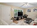 Open living room filled with natural light, neutral walls, and comfortable seating arrangements at 133 Proctor St, Gastonia, NC 28052