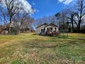 Fenced backyard offering a secure space with access to a deck and lush greenery at 1377 S Aspen St, Lincolnton, NC 28092