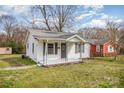 Inviting one-story home featuring a covered front porch and well-maintained lawn at 1893 Hilltop Cir, Gastonia, NC 28054