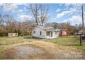 Fenced yard with a small storage shed at 1893 Hilltop Cir, Gastonia, NC 28054