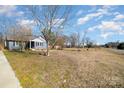 Spacious front yard with a charming single-story house set back from the road at 240 Old Limestone E Rd, York, SC 29745