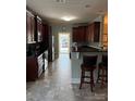 Functional kitchen with stainless steel appliances and a breakfast bar for casual dining at 422 Drake Ln, Salisbury, NC 28146