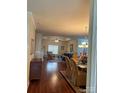 Spacious living room and dining room featuring hardwood floors, a tray ceiling, and natural light at 422 Drake Ln, Salisbury, NC 28146