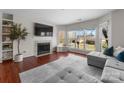 Inviting living room features a fireplace and large windows for natural light and neighborhood views at 529 N Graham St # 2G, Charlotte, NC 28202