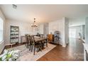 Formal dining room with hardwood floors and modern lighting at 5306 Graypark Dr, Charlotte, NC 28269