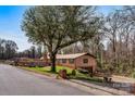 Inviting single-story home with a spacious driveway and mature trees at 1109 Hemlock Dr, Shelby, NC 28150