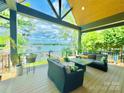 Inviting outdoor deck features comfortable seating and lake view at 121 Kelly Point Ln, Mooresville, NC 28117