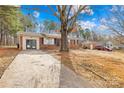 Traditional home featuring a long driveway and well-maintained backyard at 1502 Northwoods Dr, Kings Mountain, NC 28086