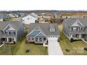 Aerial view of a well-kept, single-Gathering home in a desirable neighborhood with mature trees and landscaping at 2929 Shumard Dr, Gastonia, NC 28054