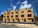 View of newly constructed apartments with exposed beams and plywood and an unfinished exterior ready for the next stage at 3018 Casting St # 20, Charlotte, NC 28206