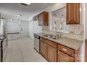 Cozy kitchen area featuring stainless steel appliances, granite countertops, and ample cabinet storage at 11000 White Stag Dr, Charlotte, NC 28269