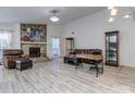 Spacious living room featuring a stone fireplace, hardwood floors, and ample seating at 11014 Fox Mill Ln, Charlotte, NC 28277