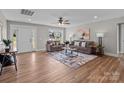 Well-lit living room with hardwood floors, a decorative rug, and comfortable seating at 130A Springway Dr, Kannapolis, NC 28081