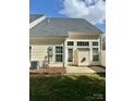 The home's rear exterior features neutral siding and a door leading to the patio at 1629 Backcreek Ln, Gastonia, NC 28054