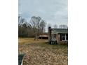 View of the home's backyard and the lot showing a storage shed in the back at 1640 Old Friendship Rd, Rock Hill, SC 29730