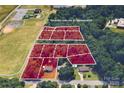 Aerial view of a parcel of land with boundary lines, surrounded by trees and neighboring buildings at 198 33Rd Nw St, Hickory, NC 28601