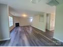 Bright living room with fireplace, complemented by hard surface floors and neutral walls at 2108 Cranberry Woods Ct, Charlotte, NC 28208