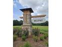 The community sign for WESTPORT set within a brick structure surrounded by landscaping at 218 Miramar Dr, York, SC 29745