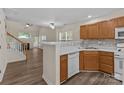 Kitchen featuring wood cabinetry and an open view of the living area at 2592 Brackley Nw Pl, Concord, NC 28027