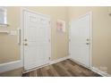 Entryway featuring two entry doors with modern flooring at 304 Valley Brook Se Ln, Concord, NC 28025