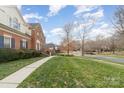 Well-maintained front yard, walkway, and landscaping, with views of neighboring homes on a sunny day at 3101 Colvard Park Way, Charlotte, NC 28269