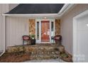 Charming front porch with stone accents and seating area at 420 Medearis Dr, Charlotte, NC 28211