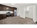 Kitchen with stainless steel appliances adjacent to laundry room at 430 Stoneycreek Ln, Rock Hill, SC 29730